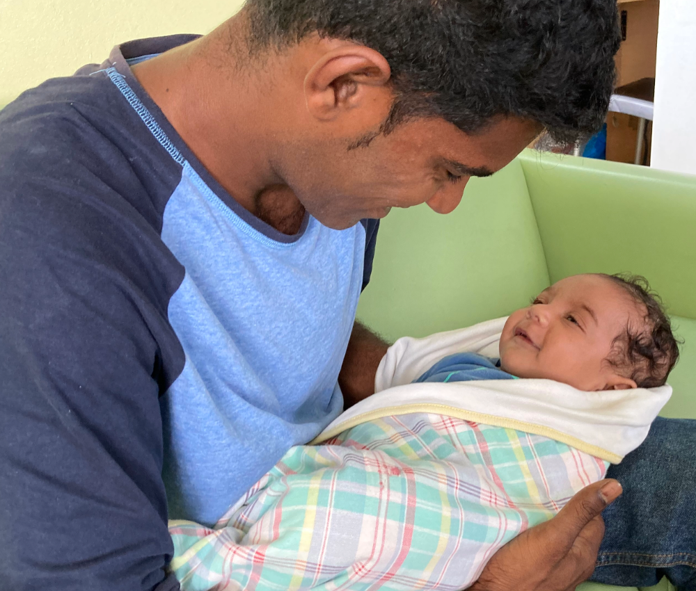 Dad holding newborn